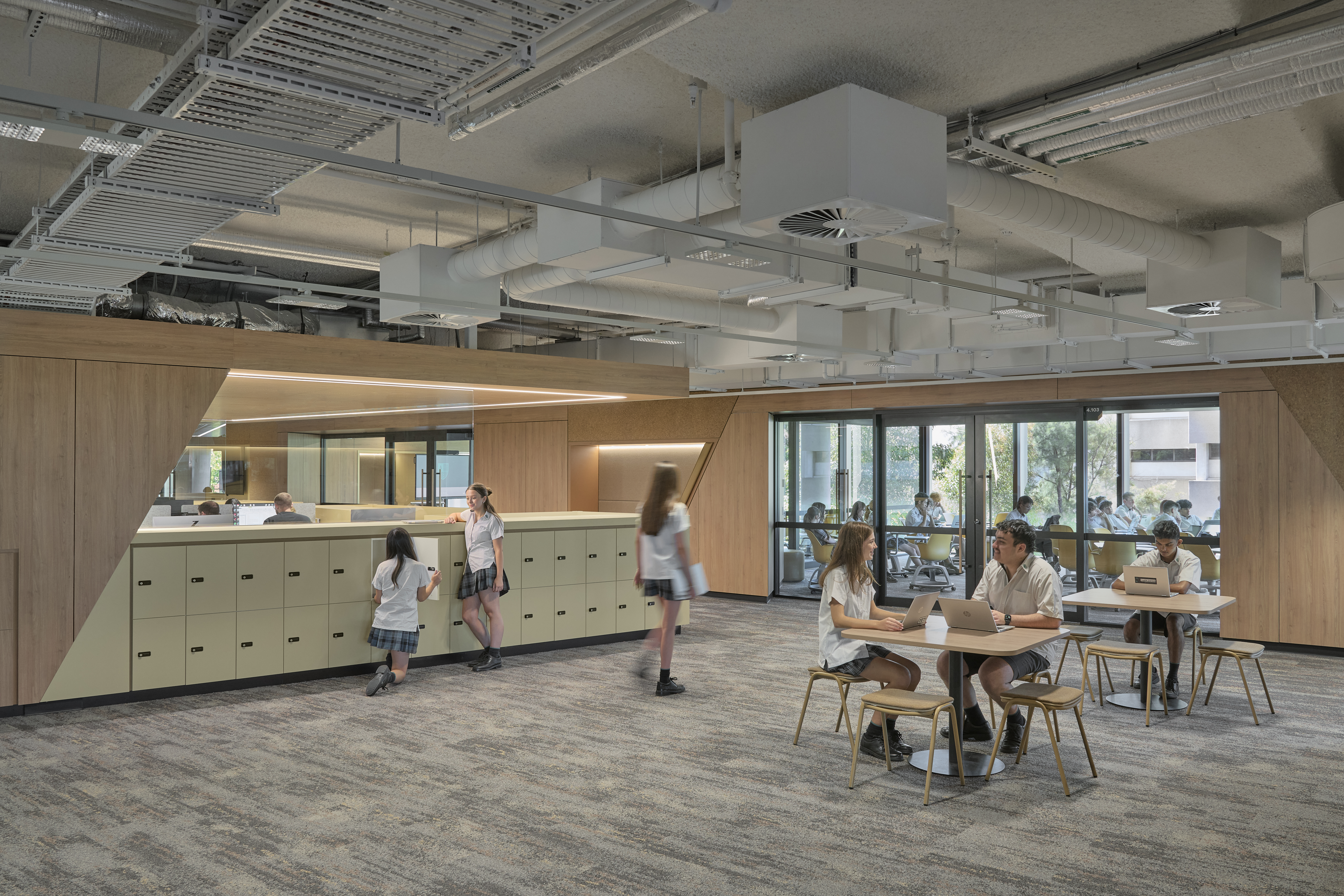 Interface Shallows and Undulating Water carpet tile in high school library