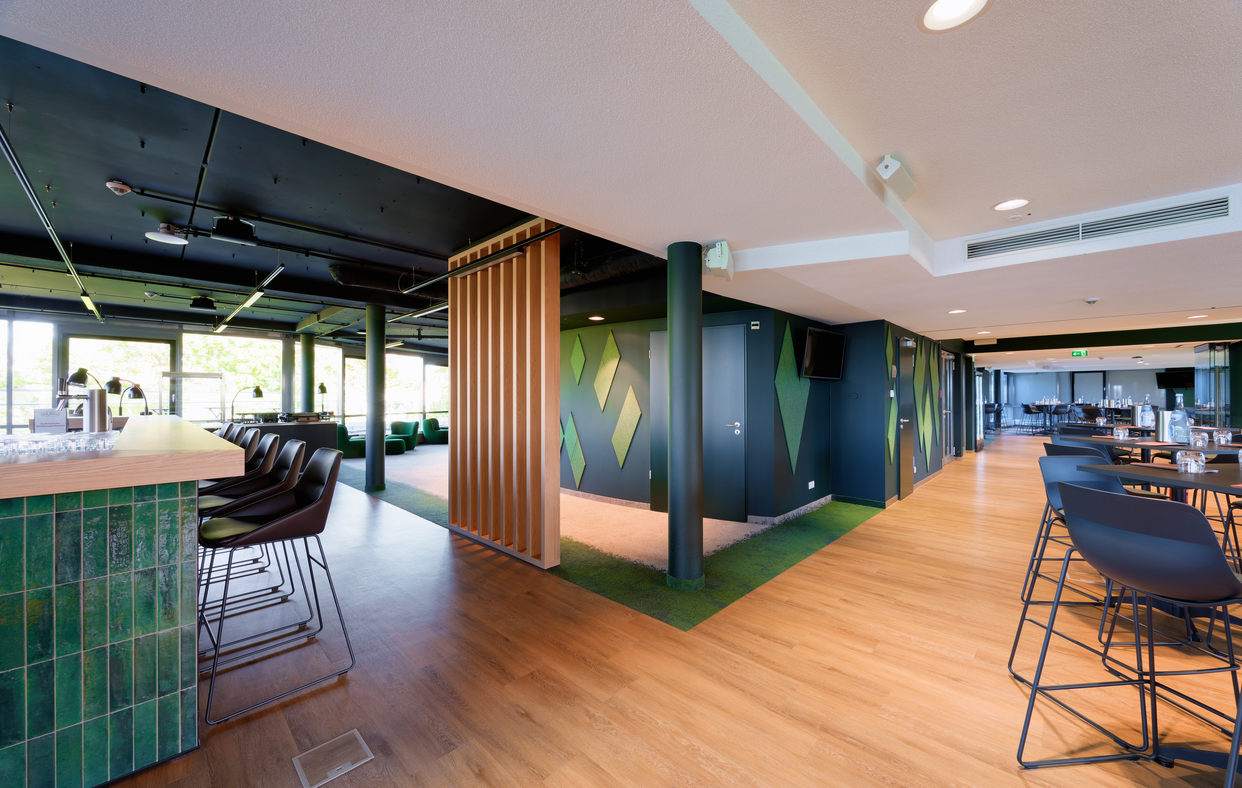 Interface Urban Retreat carpet tile and Level Set LVT in lounge setting
