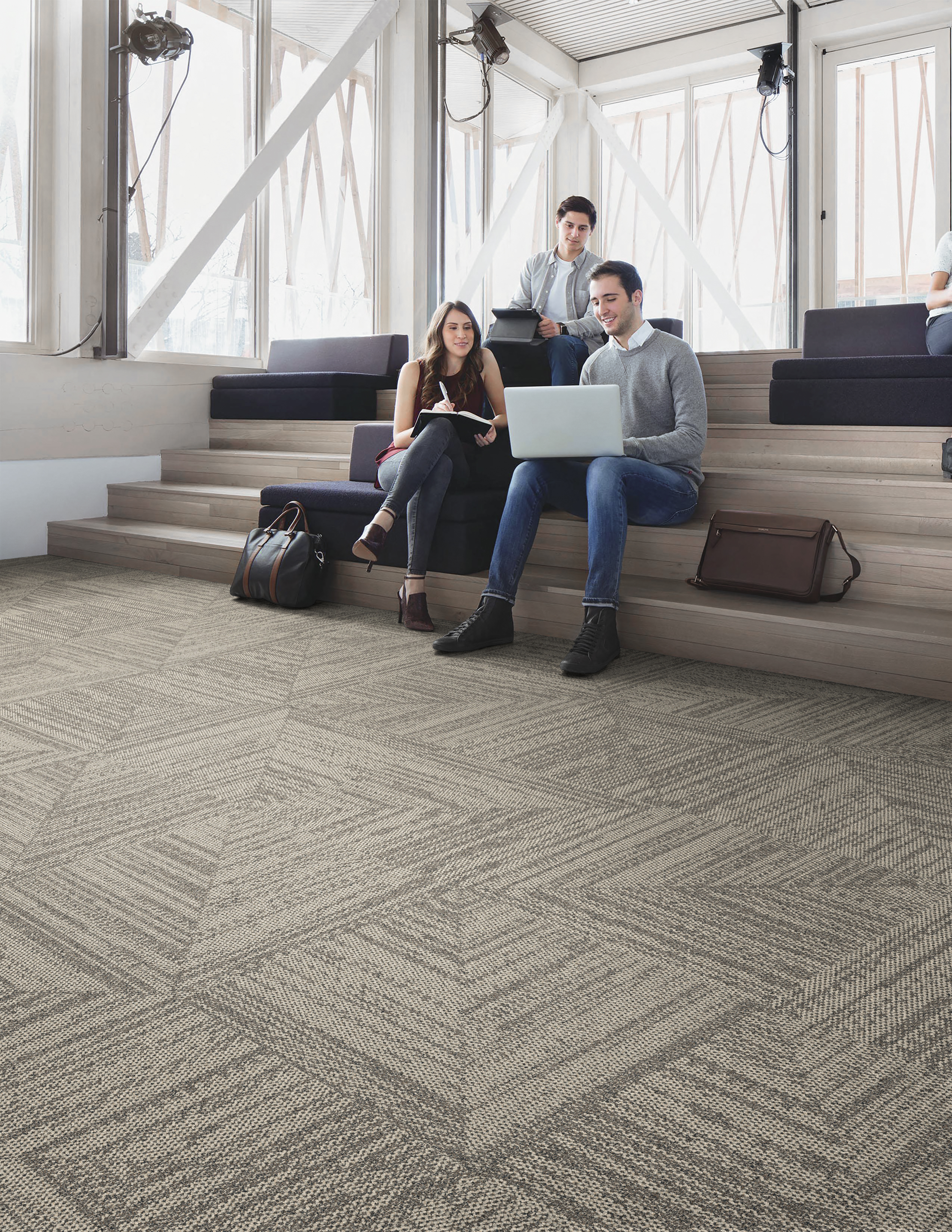Interface Open Air 403 carpet tile in public space with people seated on stiars