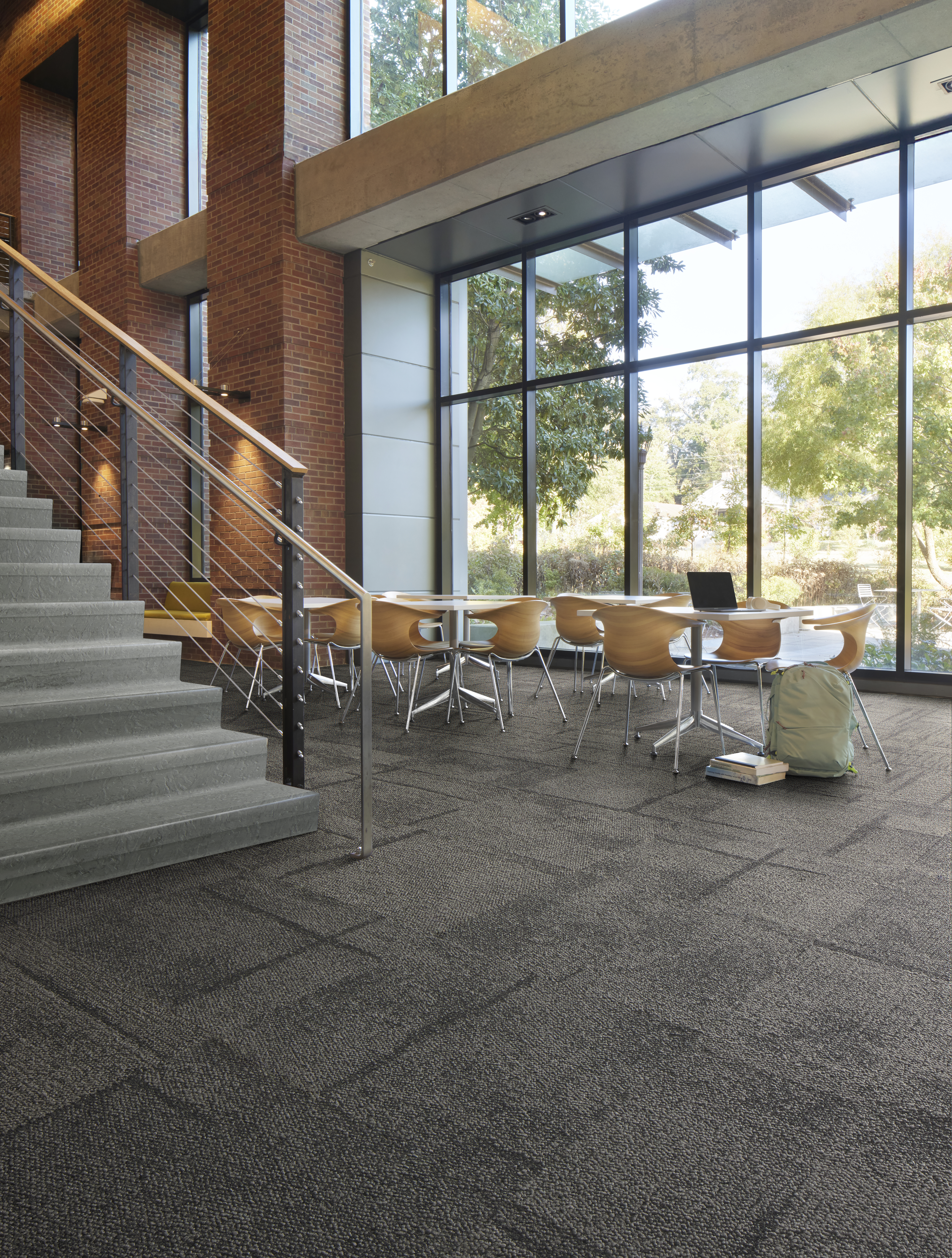 Interface Pillars and Cornerstones carpet tile in open area with norament 926 arago stairtreads on stairs