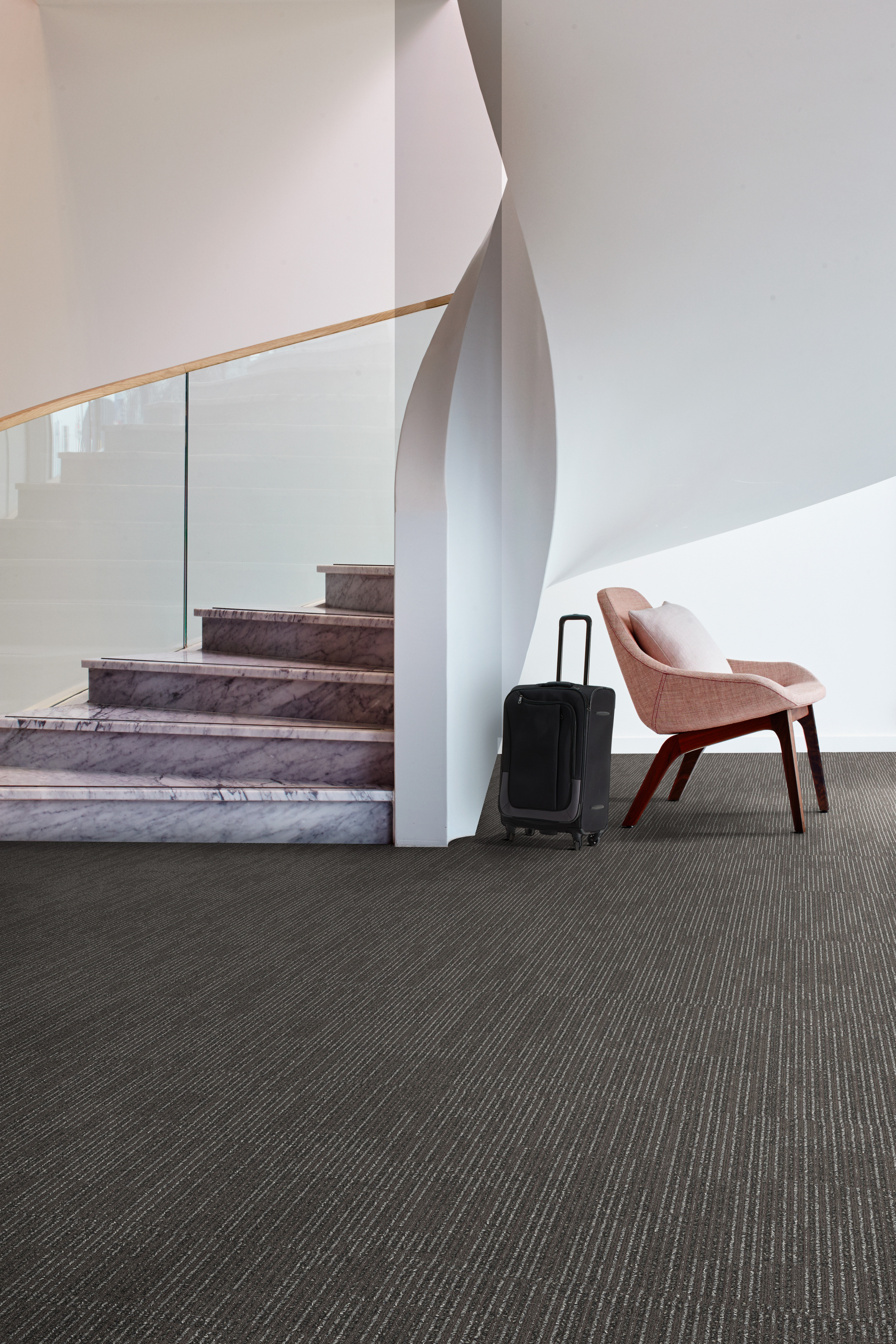 Interface SR899 carpet tile in public space with curved stairwell
