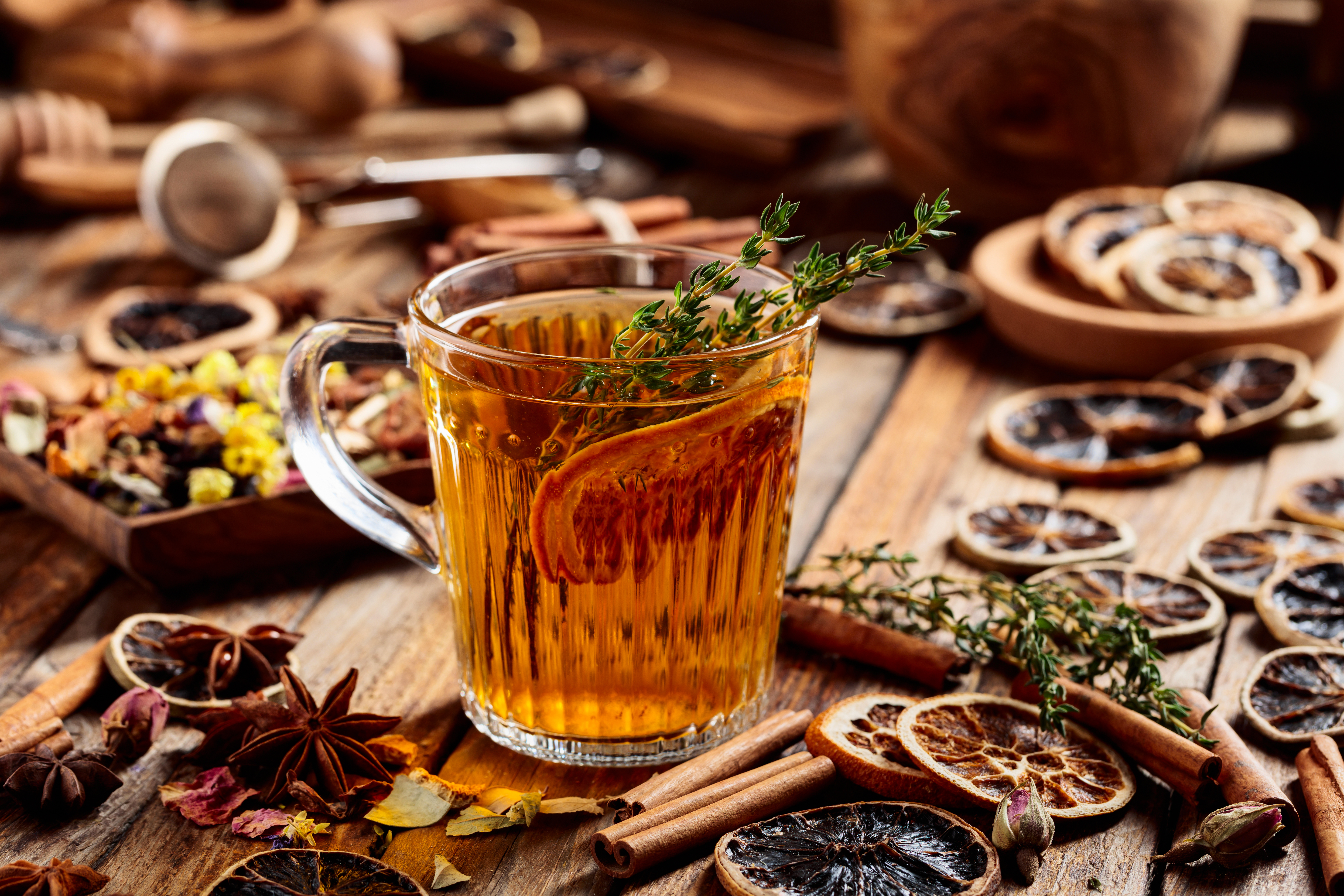 Cocktail on wooden table with dried blood oranges